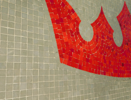 Image of restored mosaic on the wall of the former Parkway Tavern, depicting a red crown on a teal background